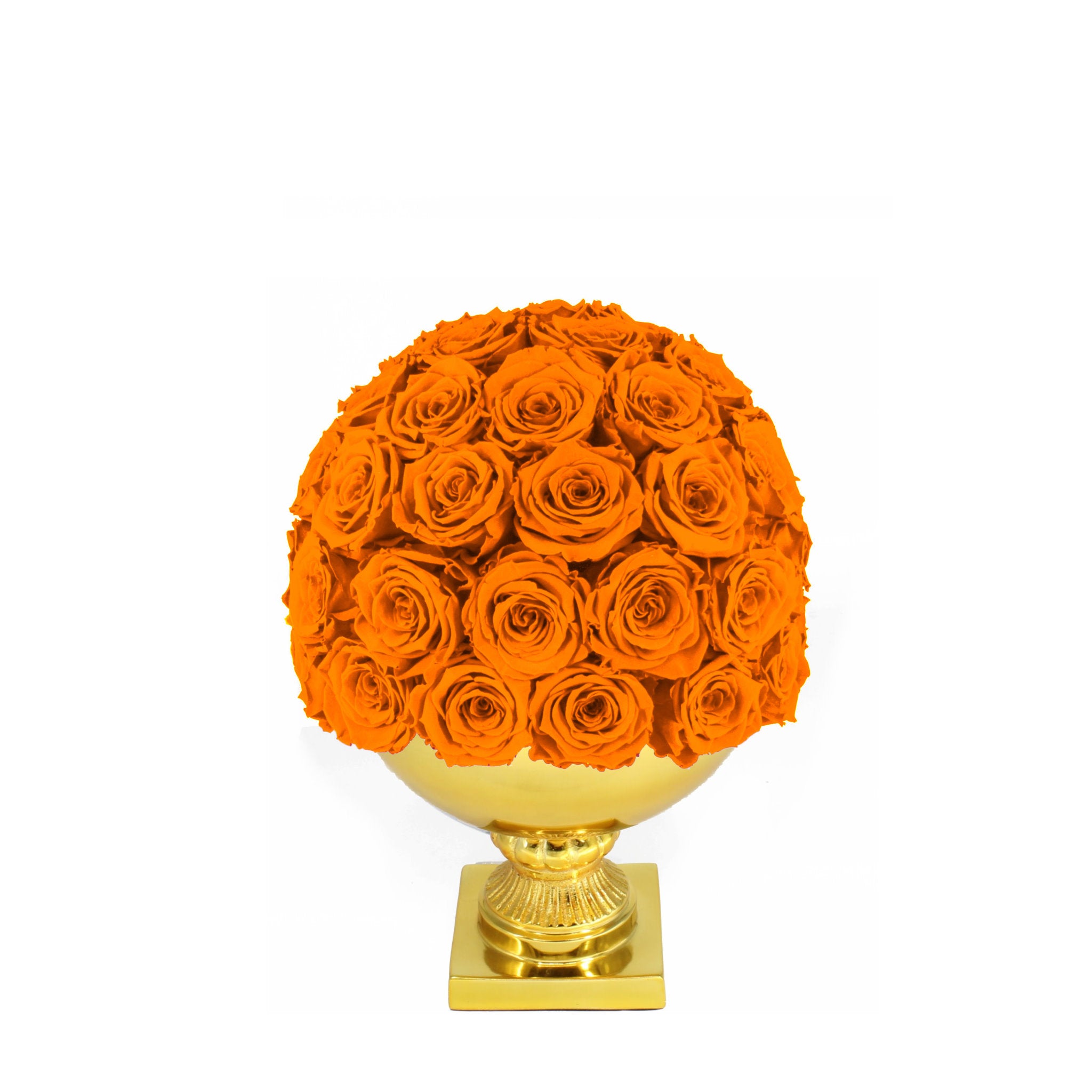 Ball of orange roses on a gold pedestal against a white background