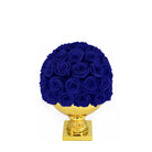 Bouquet of blue roses on a gold pedestal against a white background