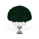 Bouquet of dark green roses in a silver vase on a white background