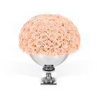 Bouquet of peach roses in a silver vase on a white background