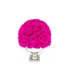 Bouquet of bright pink roses in a white vase on a white background