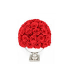 Bouquet of red roses in a white vase on a white background