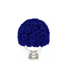 Bouquet of blue roses in a white vase on a white background