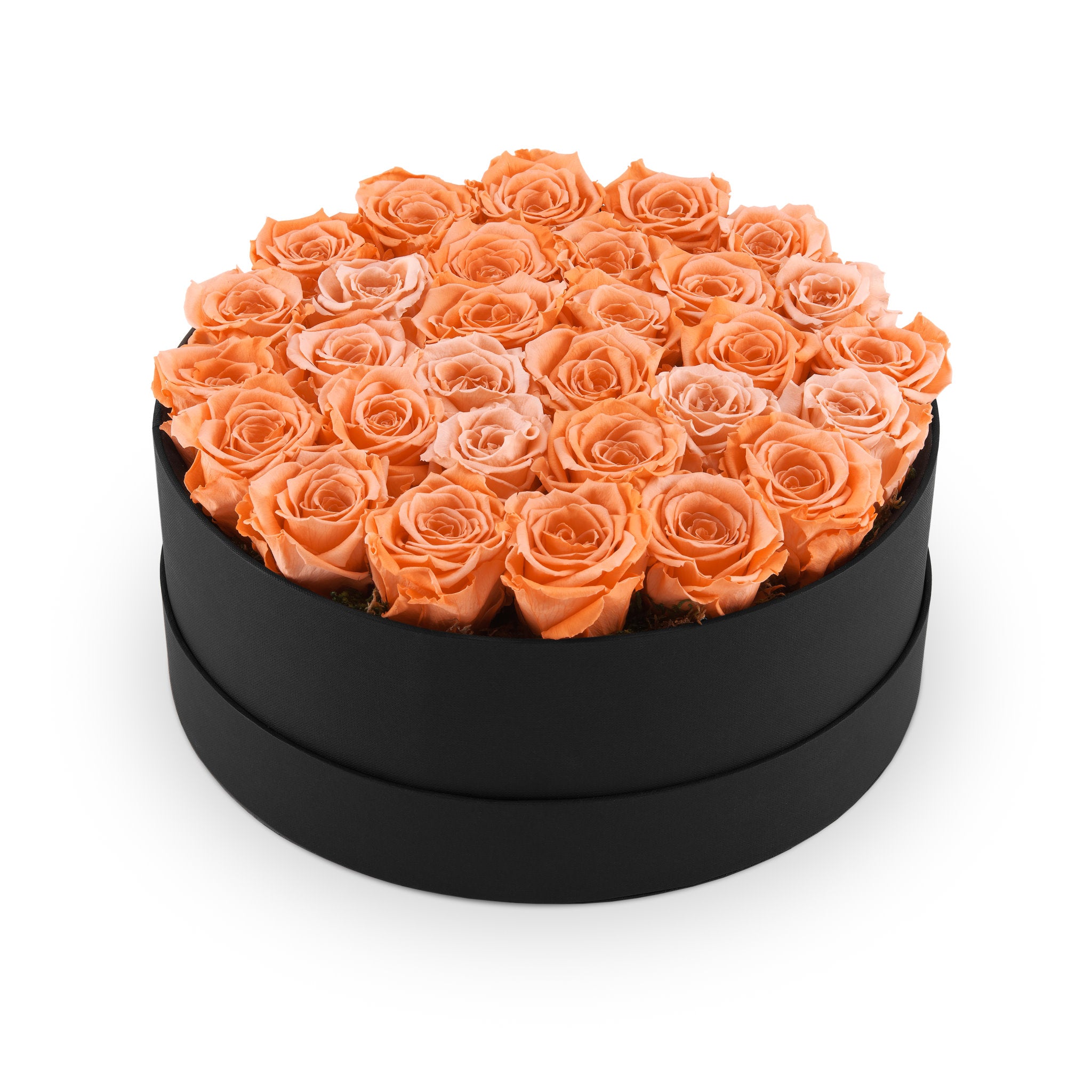 Black round box filled with orange roses on a white background