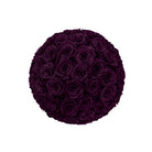 Round arrangement of dark purple roses on a white background