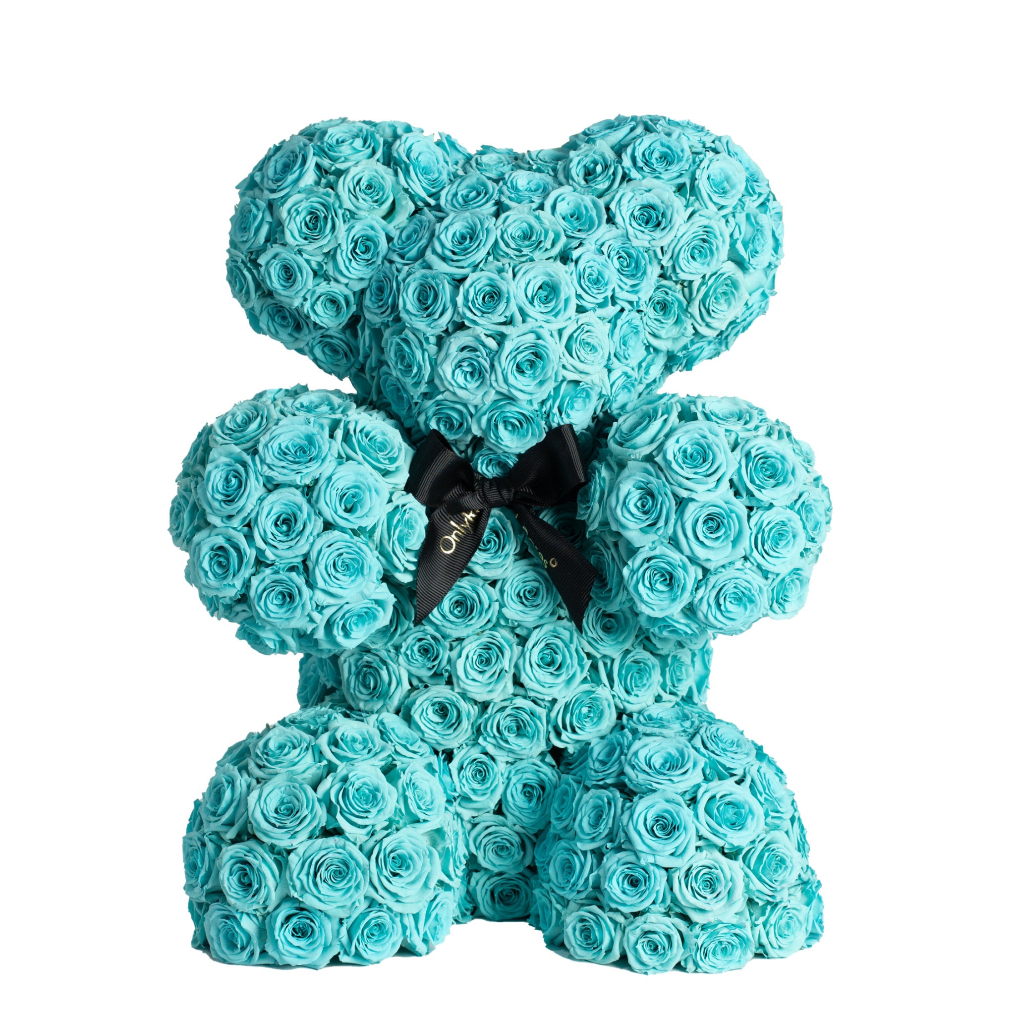 Turquoise rose teddy bear with a black bow on a white background
