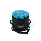 Black box with blue roses and 'Only Roses' branding on a white background