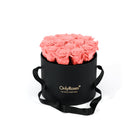 Black round box with coral pink roses and 'Only Roses' branding on a white background