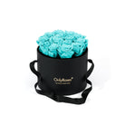 Black box with turquoise roses and 'Only Roses' branding on a white background