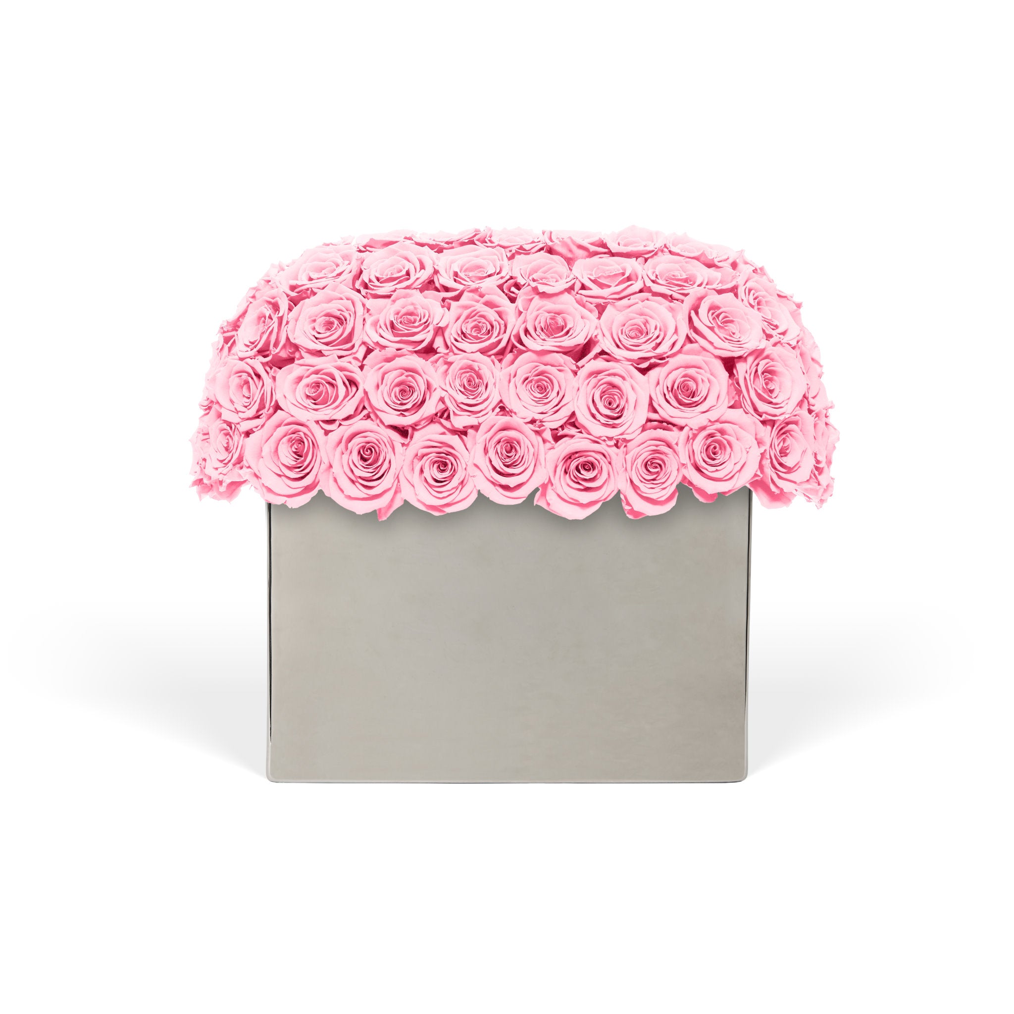 Pink rose arrangement in a gray box on a white background