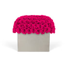 Square gray box with a vibrant pink rose arrangement on a white background